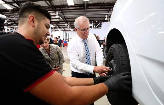 ScoMo changing a tyre Blank Meme Template