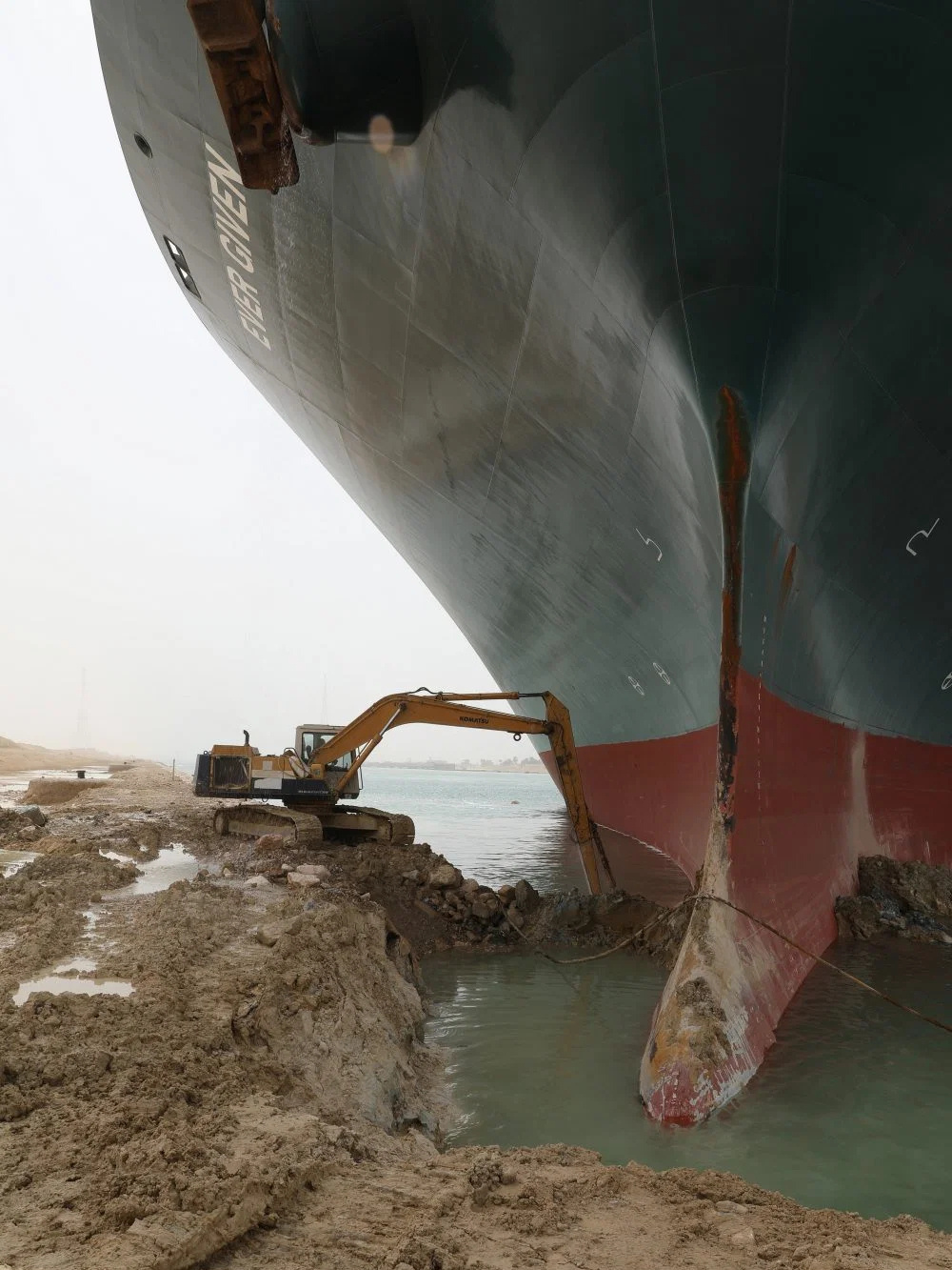 Giant ship tiny excavator at Suez canal Blank Meme Template