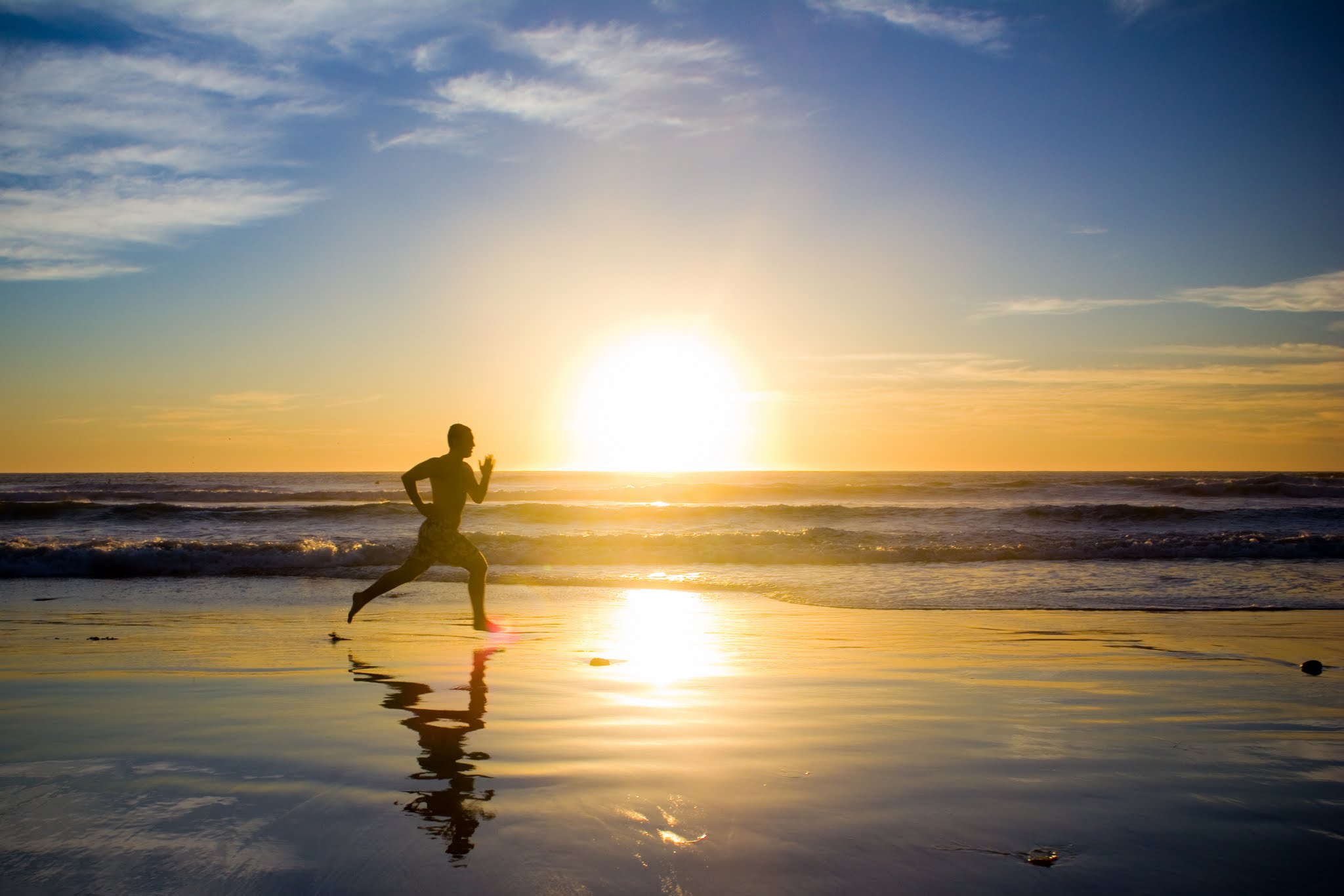 Running in front of a sunset at the beach Blank Meme Template