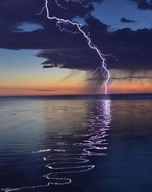 Lightning Reflecting | image tagged in lightning,reflection,water,awesome pic | made w/ Imgflip meme maker