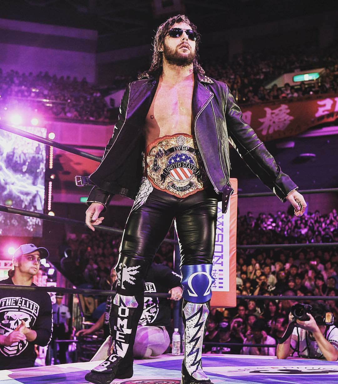 Njpw wrestling. Кенни Омега NJPW. WWE Kenny Omega. Kenny Omega AJ Styles. NJPW Kenny Omega 2 USA Championship.