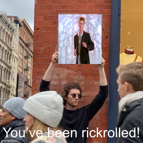 Guy Holding Rickroll Sign | You’ve been rickrolled! | image tagged in memes,guy holding cardboard sign,rickroll | made w/ Imgflip meme maker