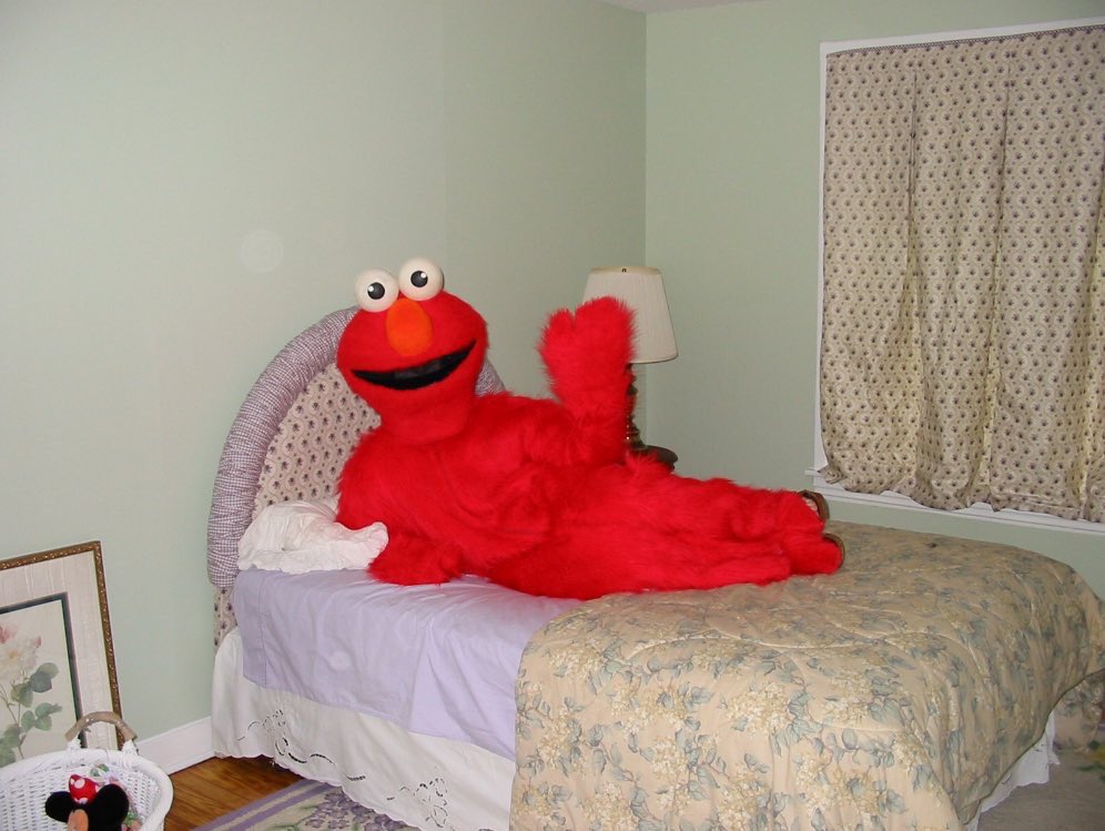 Elmo laying on bed Blank Meme Template