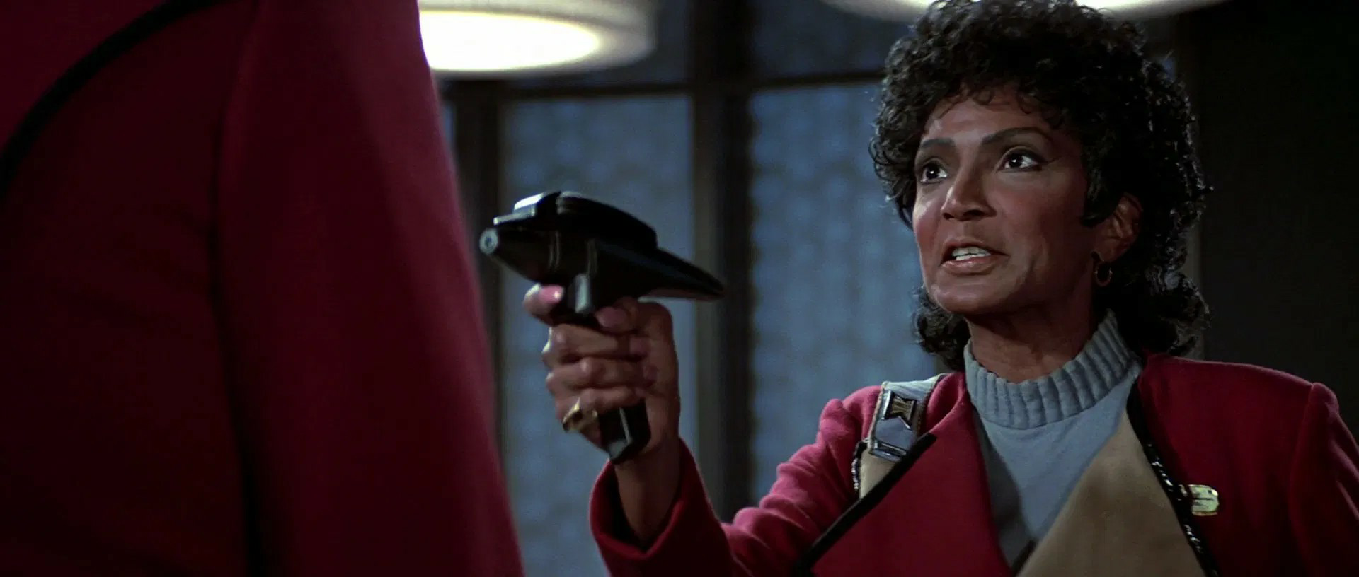 Star Trek OS Uhura phaser pointed at cadet 5 Blank Meme Template