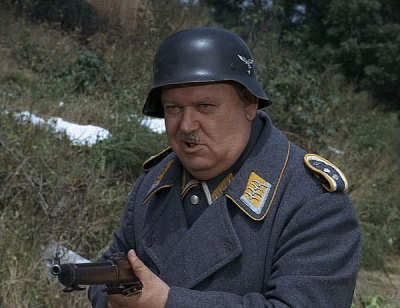 Schultz from Hogan's Heroes with gun 1 Blank Meme Template