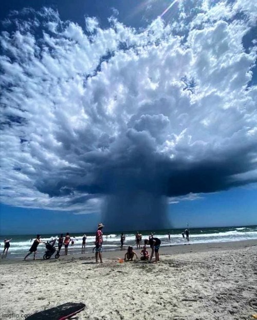Watching the cloud show | image tagged in ocean,day at the beach,mushroomcloudy,don't worry be happy | made w/ Imgflip meme maker