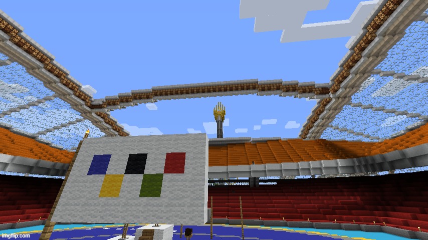 While the discus is set up here's a nice photo of the Olympic flag and flame | made w/ Imgflip meme maker