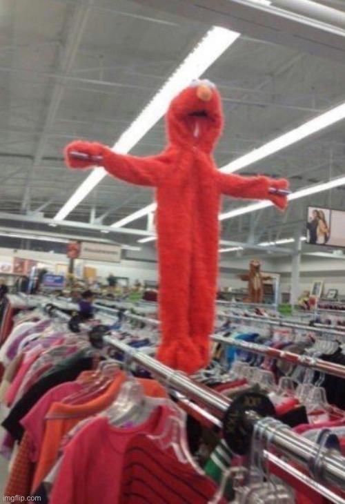 What is that Elmo doing over there? | image tagged in elmo,cursed | made w/ Imgflip meme maker