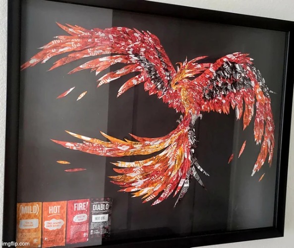 This is an artwork made out of only Taco Bell hot sauce packets. | image tagged in cool | made w/ Imgflip meme maker