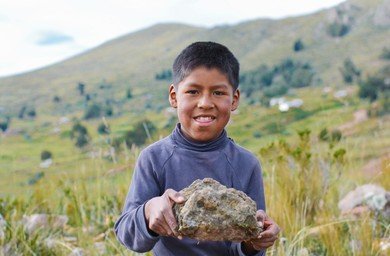 Boy holding a rock Blank Meme Template