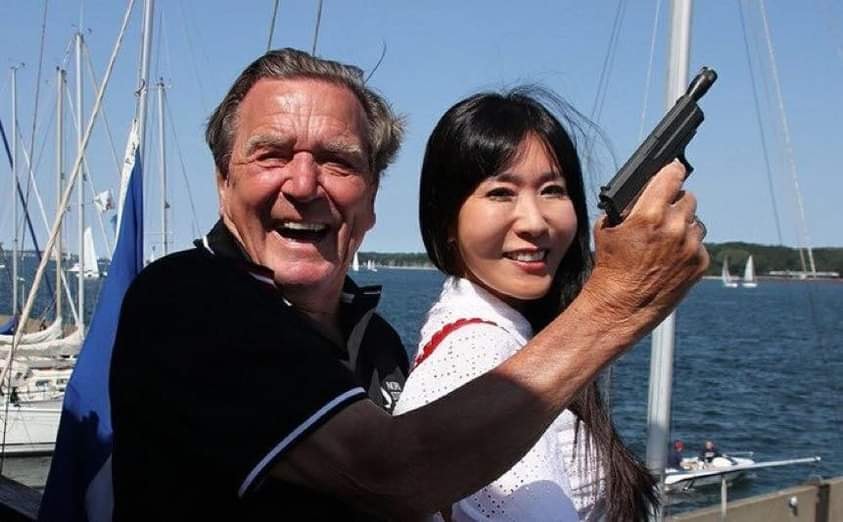 High Quality Gerhard Schröder with gun and wife Blank Meme Template