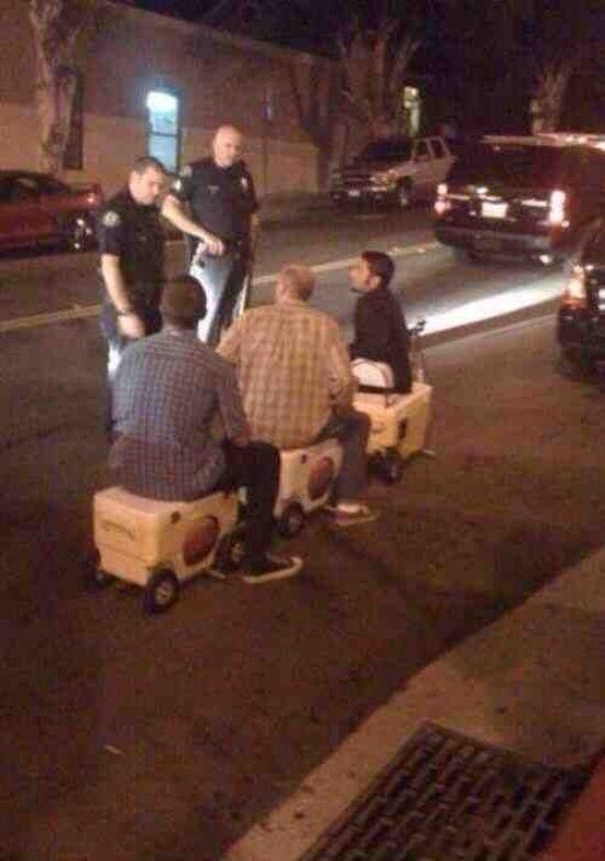 High Quality three men riding on coolers? pulled over by the cops Blank Meme Template