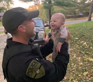 Cop with infant Blank Meme Template