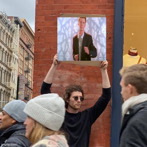 Rick Rolled lol | image tagged in memes,guy holding cardboard sign | made w/ Imgflip meme maker