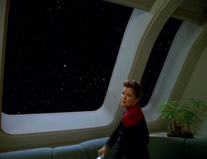 Captain Janeway looking out the window. Blank Meme Template