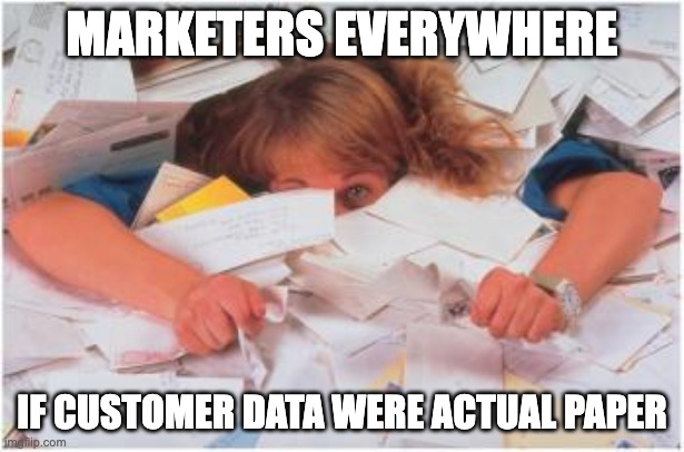 marketer buried in piles of paper meme: Marketers everywhere, if customer data were actual paper - why a customer data platform matters