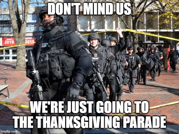 Just another day in Amerifat... gear up,everyone! | DON'T MIND US; WE'RE JUST GOING TO THE THANKSGIVING PARADE | image tagged in christmas parade,car murderer,black man,violent past | made w/ Imgflip meme maker
