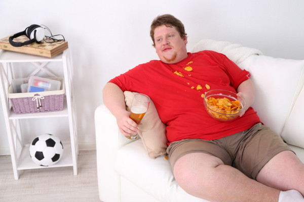 fat man on couch eating chips Blank Meme Template