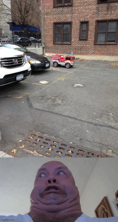 Fire truck toy | image tagged in uhhhhh,fire truck,toy,you had one job,memes,parking lot | made w/ Imgflip meme maker