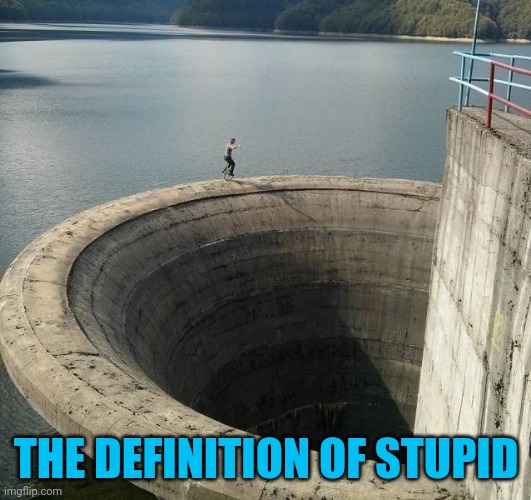 What is he trying to prove? | THE DEFINITION OF STUPID | image tagged in memes,dumb | made w/ Imgflip meme maker