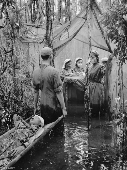 A makeshift hospital from the Vietnam War | image tagged in crazy photos,hospital,vietnam war | made w/ Imgflip meme maker