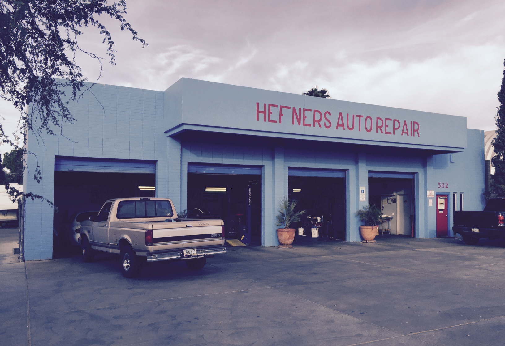 Hefner's Auto Repair shop car vehicle work Blank Meme Template