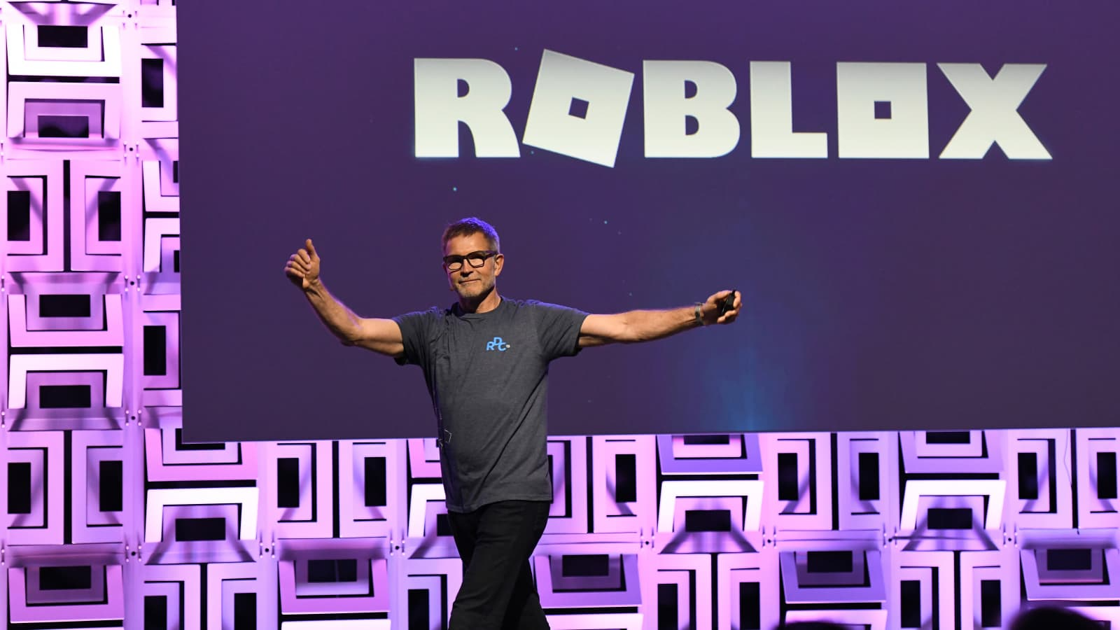 David Baszucki in front of roblox logo Blank Meme Template
