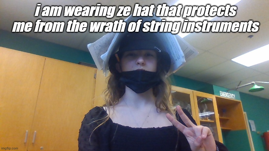 it is a music book | i am wearing ze hat that protects me from the wrath of string instruments | made w/ Imgflip meme maker