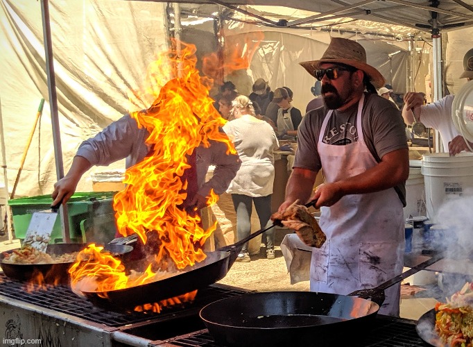 Flame on! Chef at Gilroy Garlic Festival | image tagged in memes,gilroy,garlic,cooking,chef,flame | made w/ Imgflip meme maker