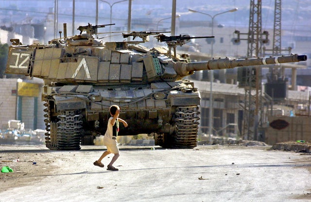 High Quality Palestinian child throwing a rock at an Israeli tank Blank Meme Template