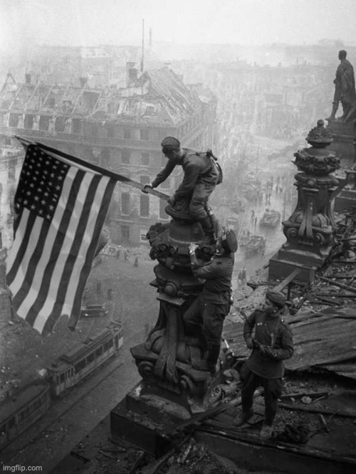 US Marines hoist the Stars and Stripes over the Reichstag as US forces enter Berlin, 1945 | image tagged in alternate history | made w/ Imgflip meme maker