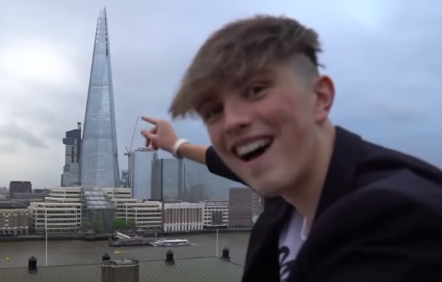 Morgz pointing a building Blank Meme Template