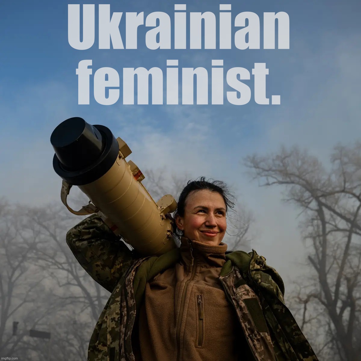 Ukrainian commander of anti-tank missile unit hoists her Stugna-P missile launcher after an ambush on Russian troops near Kiev. | Ukrainian feminist. | image tagged in ukrainian missile launcher | made w/ Imgflip meme maker