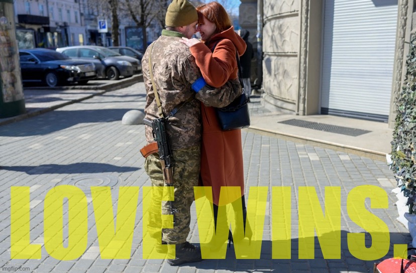 A Ukrainian soldier embraces his wife in the center of Odessa on March 17, 2022. | LOVE WINS. | image tagged in ukrainian soldier hugs wife,ukraine,ukrainian lives matter,ukrainian,love,wins | made w/ Imgflip meme maker