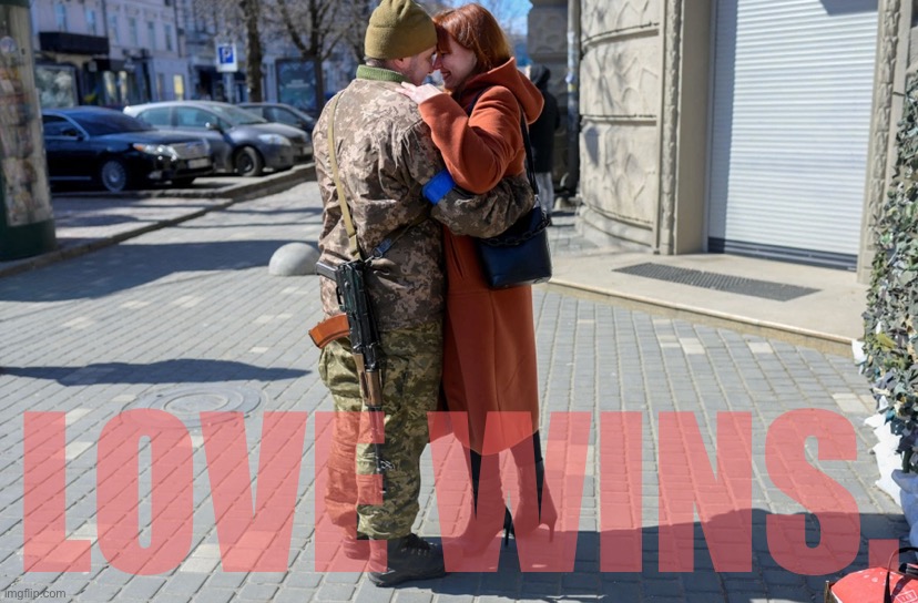 A Ukrainian soldier embraces his wife in the center of Odessa on March 17, 2022. | LOVE WINS. | image tagged in ukrainian soldier hugs wife | made w/ Imgflip meme maker