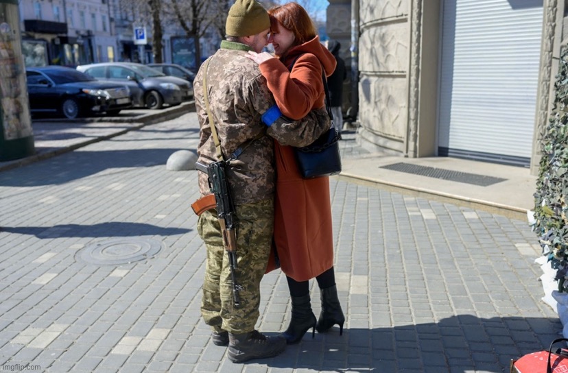 . | image tagged in ukrainian soldier hugs wife | made w/ Imgflip meme maker
