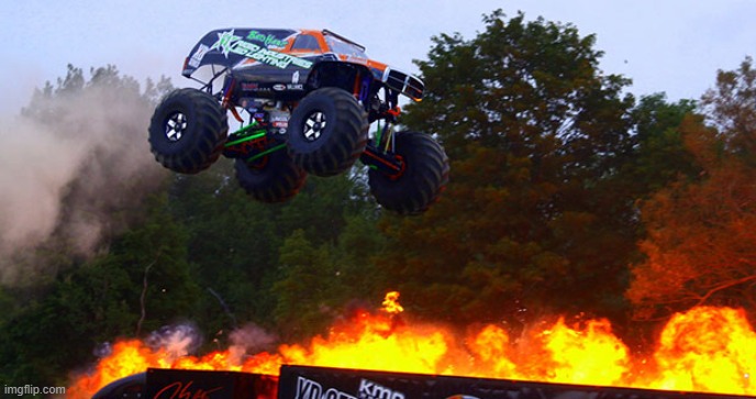 Monster truck jumping flames world record jump | image tagged in monster truck jumping flames world record jump | made w/ Imgflip meme maker