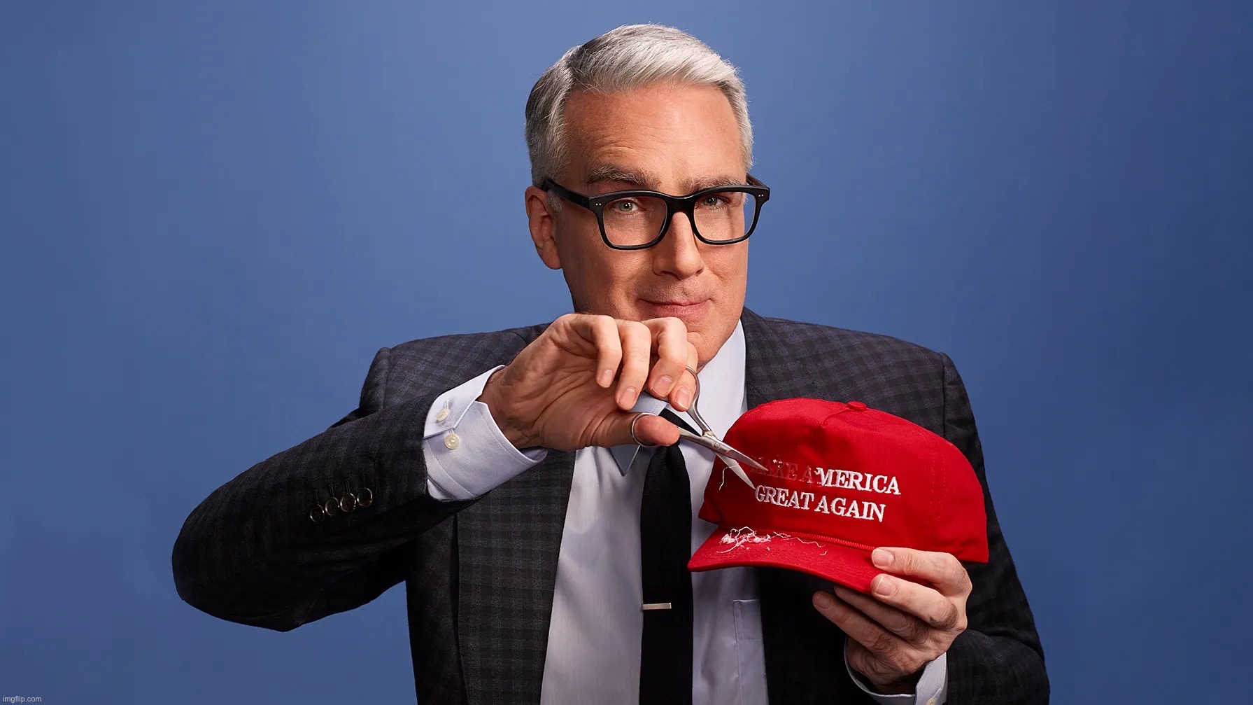 Keith Olbermann mangles a MAGA hat | image tagged in keith olbermann mangles a maga hat | made w/ Imgflip meme maker