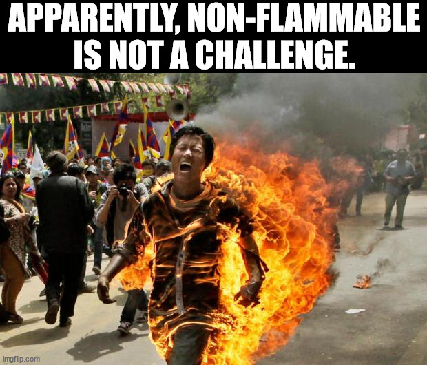 burning man | APPARENTLY, NON-FLAMMABLE IS NOT A CHALLENGE. | image tagged in burning man,dark humor | made w/ Imgflip meme maker