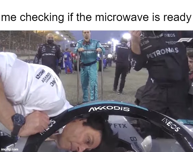 want some popcorn | me checking if the microwave is ready | image tagged in toto wolff,f1,meme,funny | made w/ Imgflip meme maker