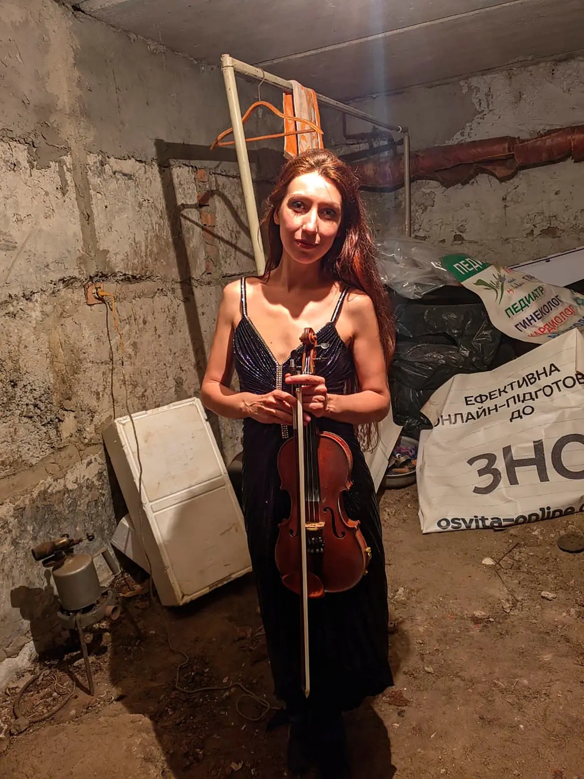 Ukrainian violinist in bomb shelter Blank Meme Template
