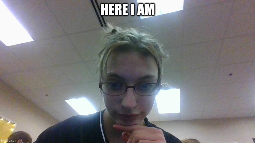 cutie | HERE I AM | image tagged in disaster girl | made w/ Imgflip meme maker