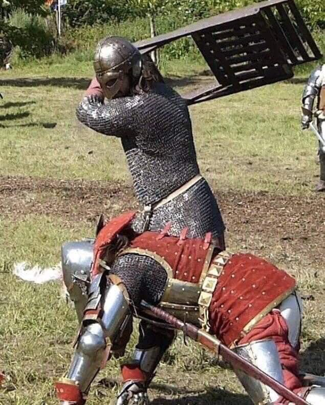 High Quality KNIGHT IN ARMOR HITS A GUY WITH A CHAIR Blank Meme Template
