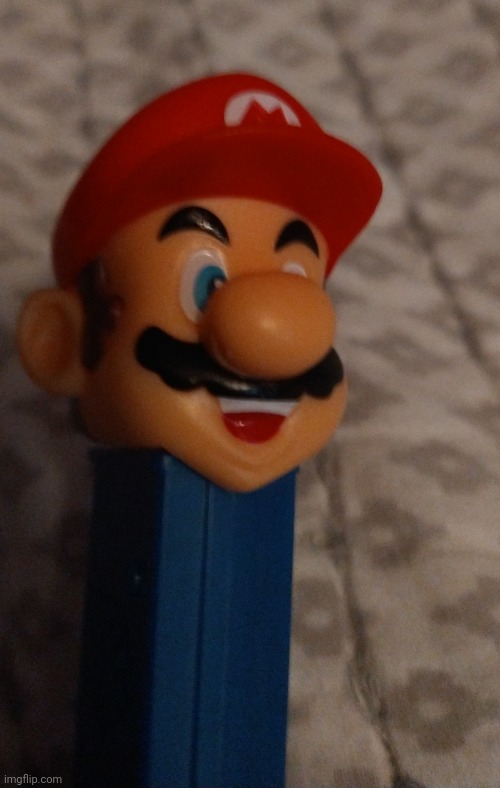 image tagged in mario pez dispenser | made w/ Imgflip meme maker