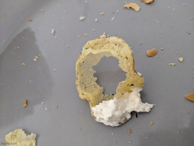 inflated chip with hole in the middle (i dipped it before i realised what it was) | made w/ Imgflip meme maker