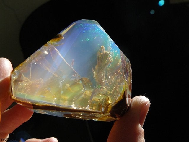 Ethiopian Welo Opal New gem found looks like the ocean in rock | image tagged in ethiopian welo opal new gem found looks like the ocean in rock | made w/ Imgflip meme maker