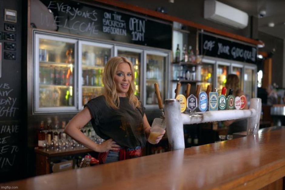 Kylie Minogue pours a beer | image tagged in kylie minogue pours a beer | made w/ Imgflip meme maker