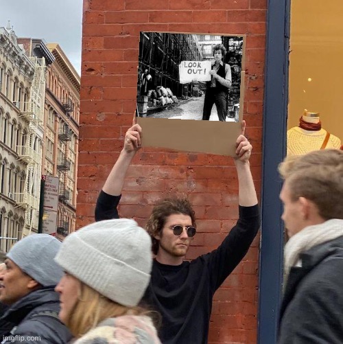 Look out | image tagged in memes,guy holding cardboard sign,bob dylan | made w/ Imgflip meme maker