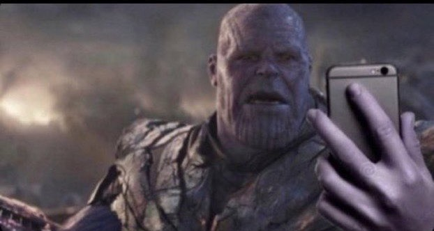 High Quality thanos holds phone Blank Meme Template