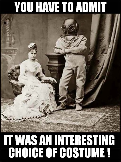 Vintage Couple Have Portrait Photograph Taken ! | YOU HAVE TO ADMIT; IT WAS AN INTERESTING CHOICE OF COSTUME ! | image tagged in vintage,couple,photography | made w/ Imgflip meme maker